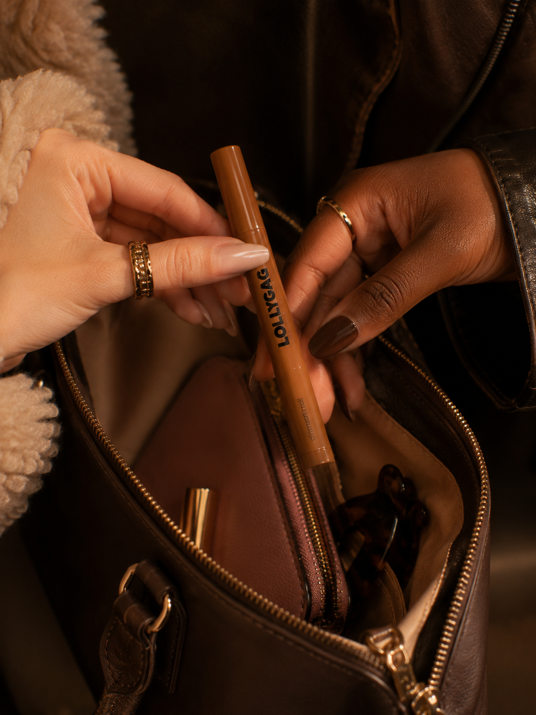 Cinnamon Roll passed between hands over a leather bag